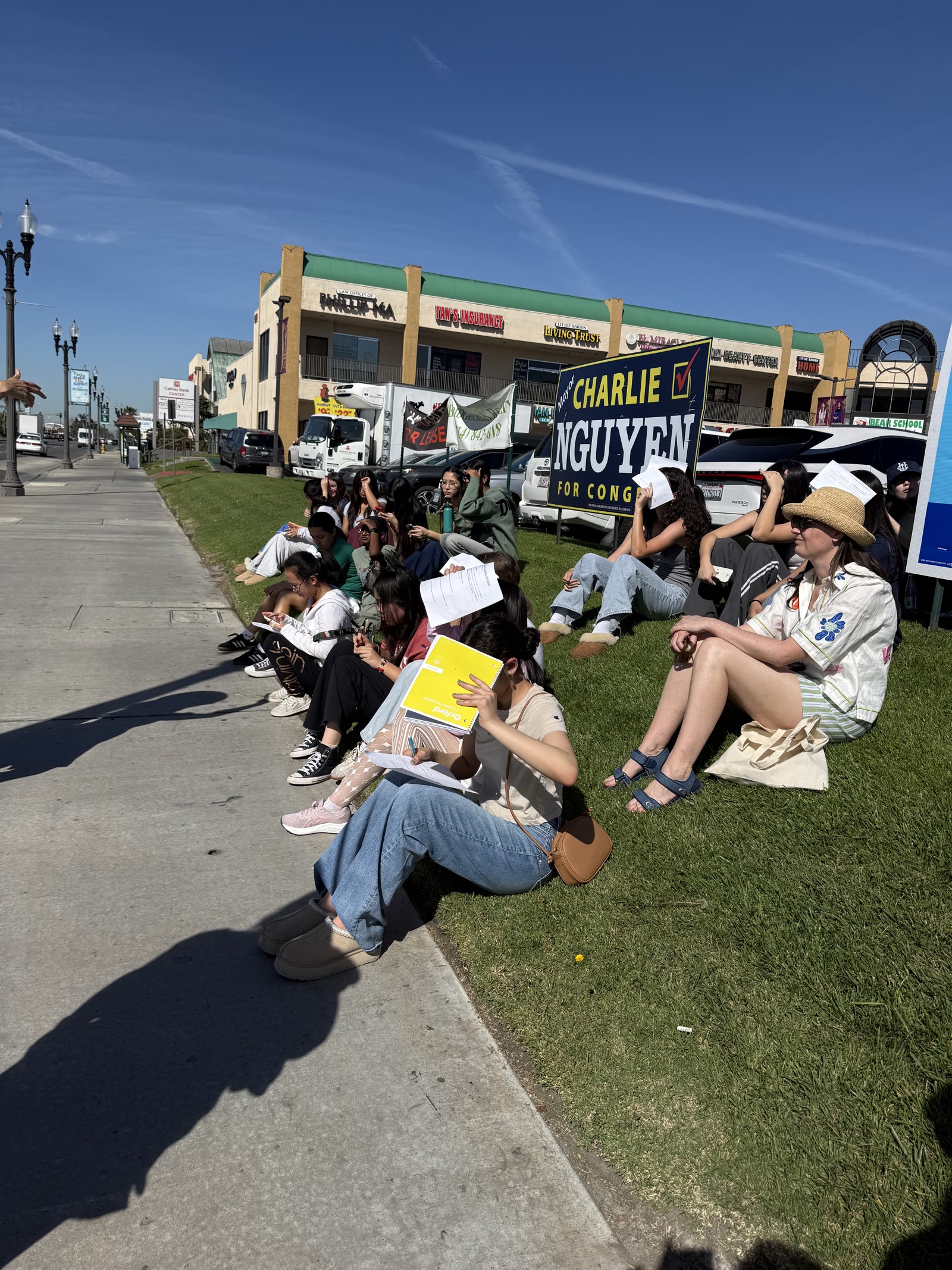 Students resting during the Little Saigon neighborhood tour