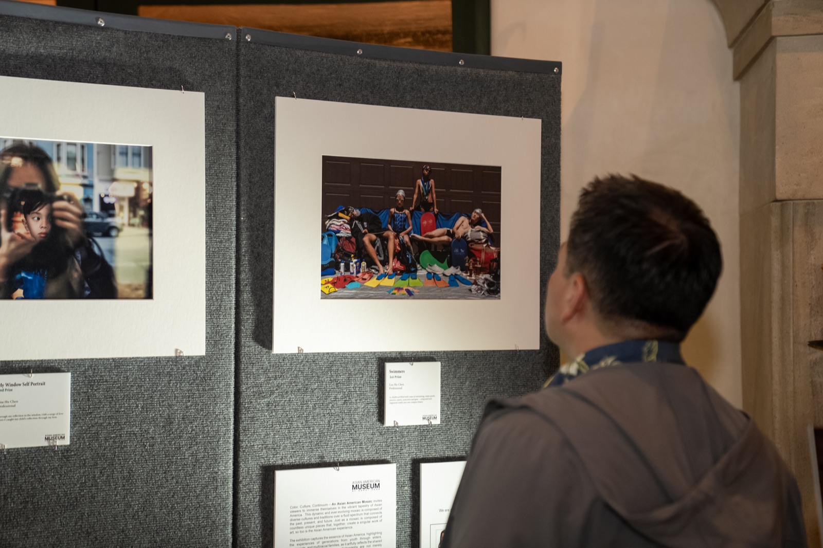 Visitor viewing Mosaic photography at Bowers Museum